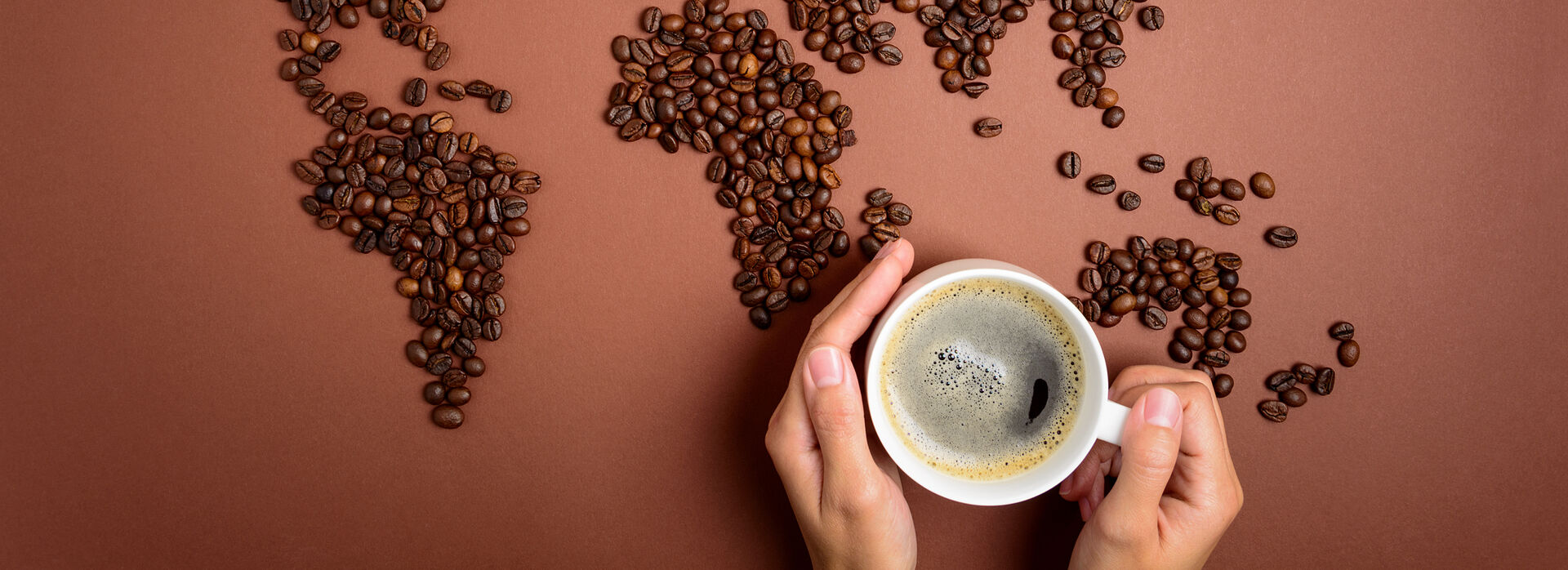 Cup of Coffee with coffee beans surrounding