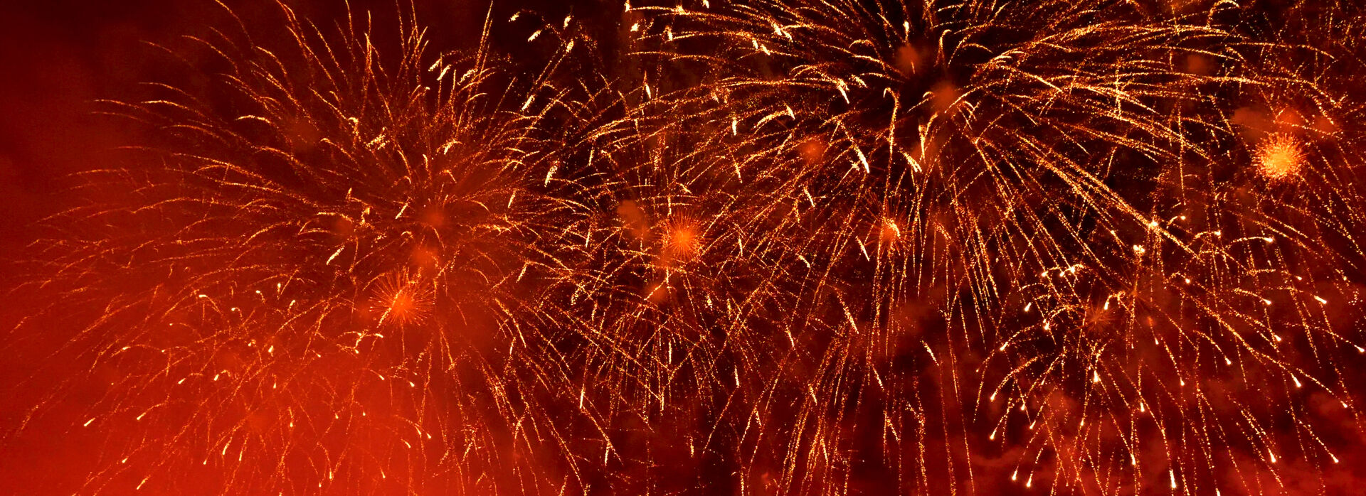 Red fireworks in night sky