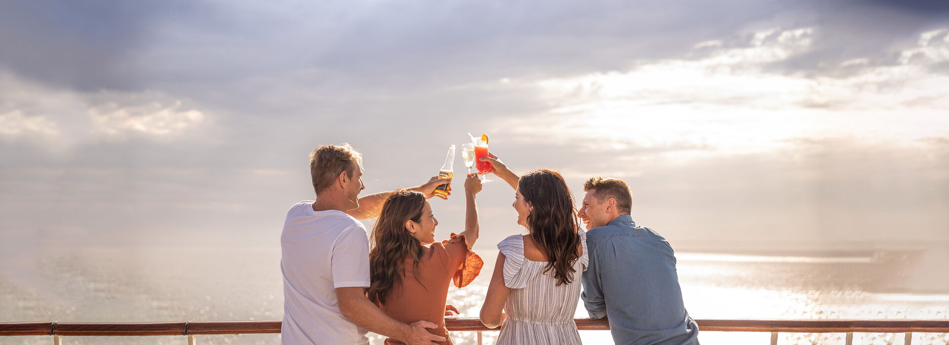Group of travellers on deck enjoying a drink